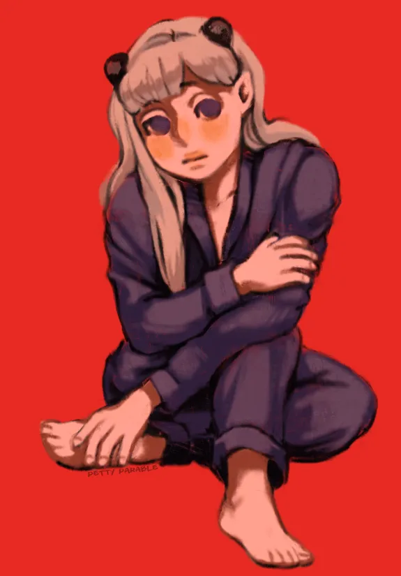 darby sitting on the ground on a bright red background that sucks the color out of her complexion. she is wearing a purple pajama set and is curled into herself defensively.